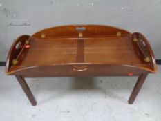 A mahogany oversized butler's tray on stand