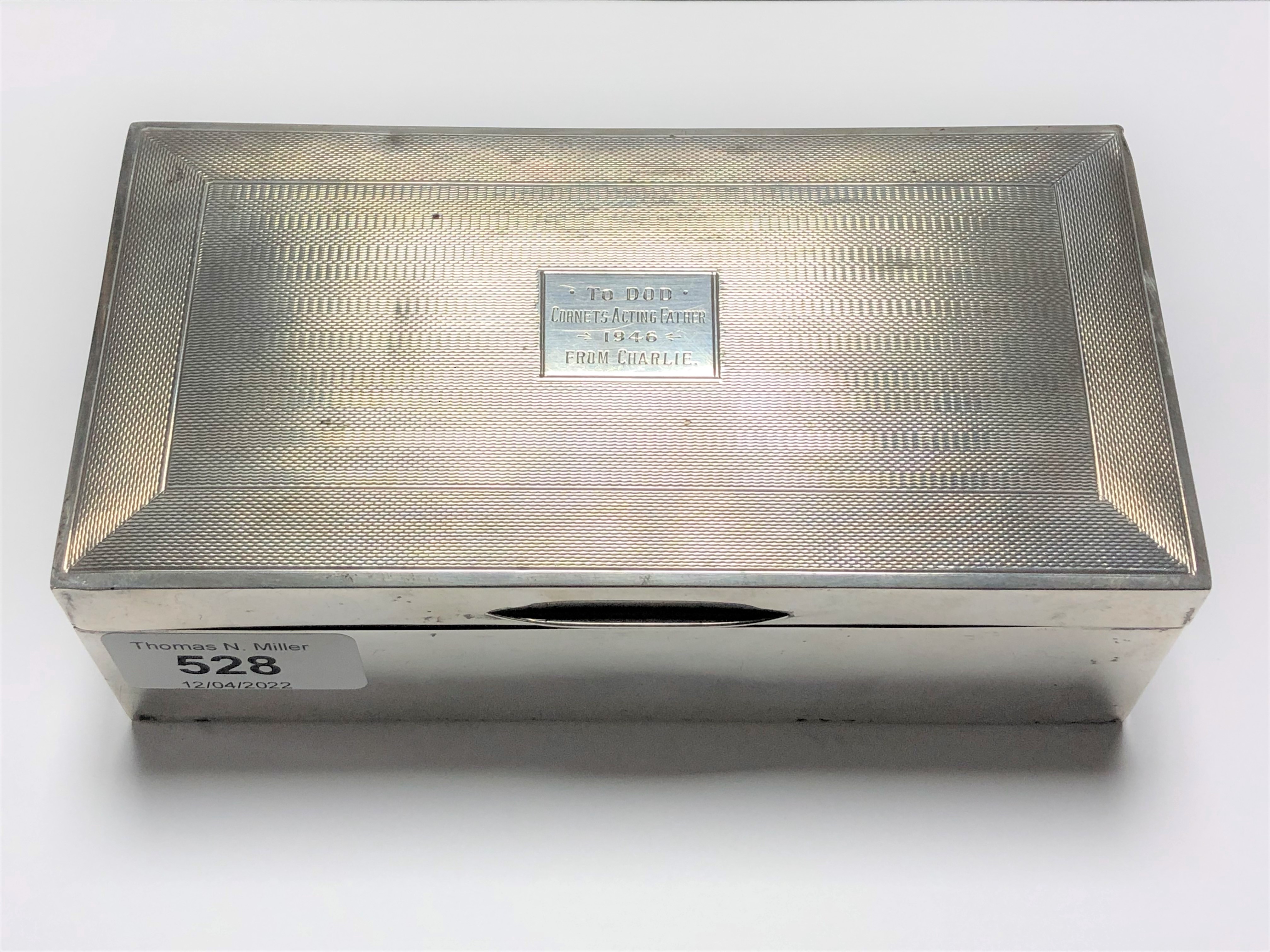 A silver cigarette box,