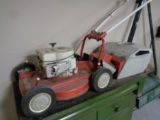 A Mountfield Briggs and Stratton petrol lawn mower with grass box