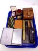 A tray of leather case of cigarette cards, pin cushion, Ronson Essex lighter, pocket knives,