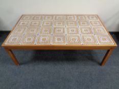 A Scandinavian tiled topped teak coffee table