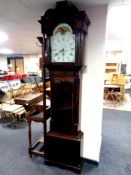 A George III mahogany eight day longcase clock with painted moon phase dial signed George Monks,