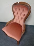 A Victorian style lady's chair in pink button dralon