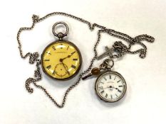 A silver fob watch with enamelled dial, on chain with silver crucifix,