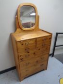 A pine seven drawer vanity chest