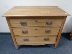 An Edwardian pine three drawer chest