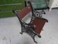 A cast iron and wood garden chair