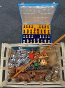 A box of wooden pieces - cased chess set, animal ornaments, walking stick, two beaded flasks,