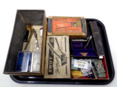 A tray of vintage sewing items, cut throat razor, boxed hair clippers, hair brushes, razor blades,