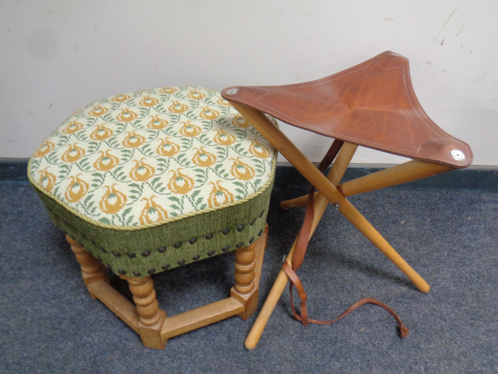 A blonde oak hexagonal footstool and a folding leather topped tripod stool