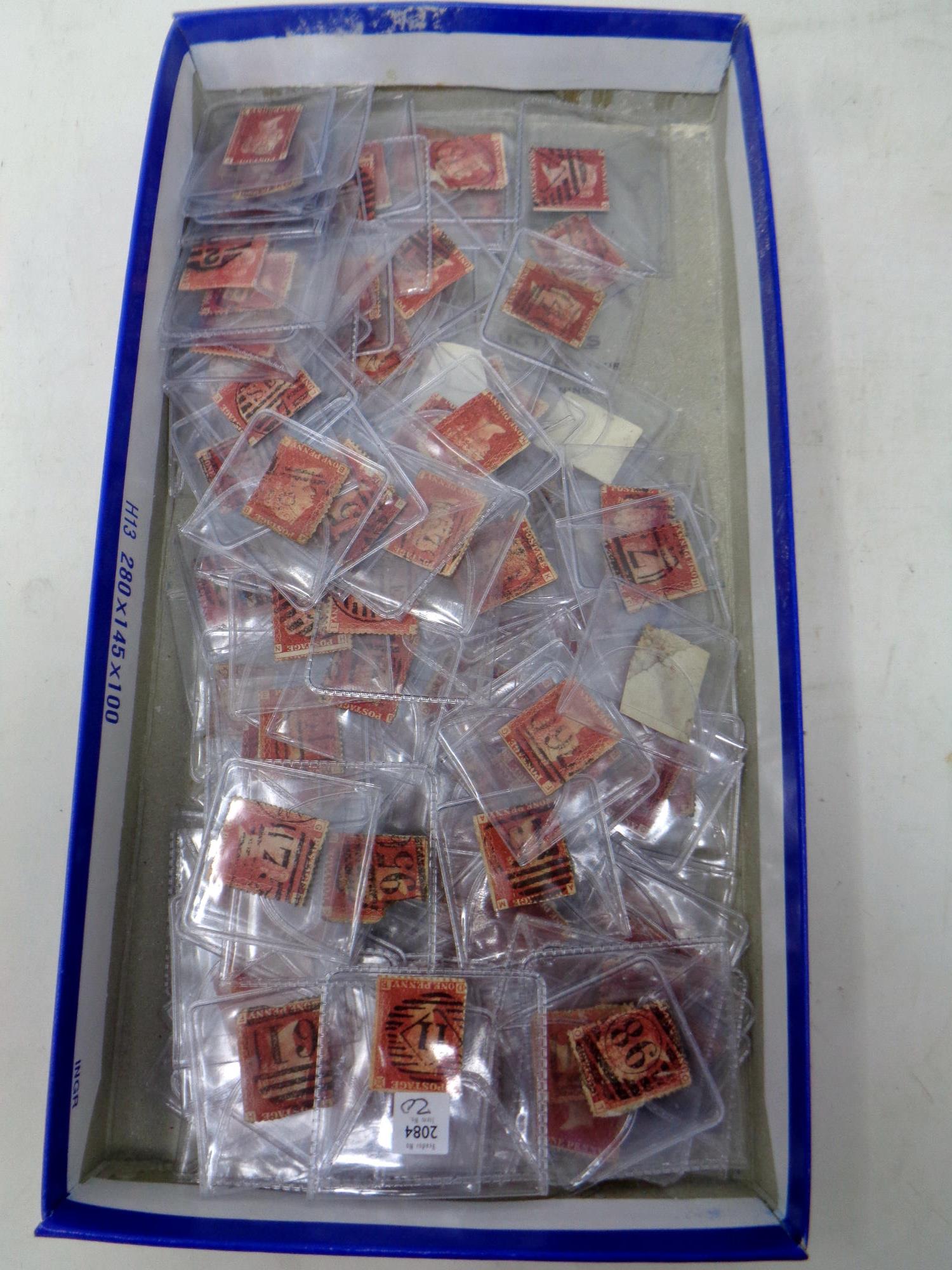 A box of approximately one hundred and forty 19th century red one penny stamps