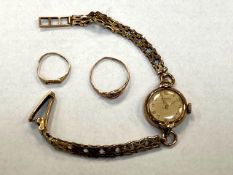 Two 9ct gold rings (damaged), together with a 9ct gold lady's wristwatch (15.3g gross).