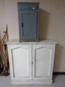 A nineteenth century painted pine double door bookcase together with a further painted bedside