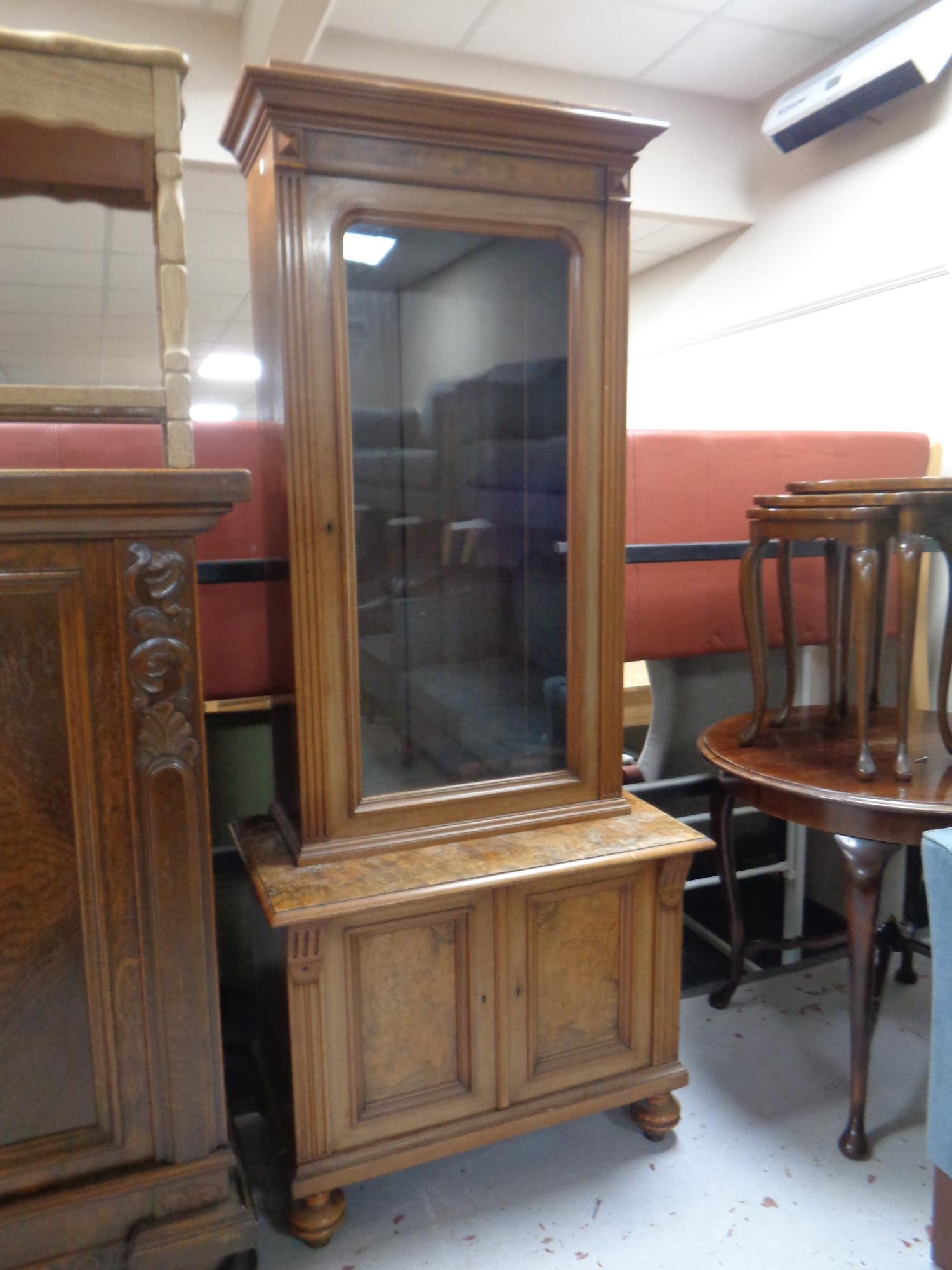 A 19th century walnut glazed door bookcase fitted double door cupboard beneath