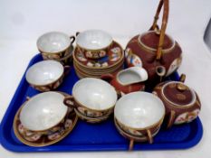 A tray of twenty two piece Japanese egg shell tea service