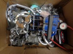 A box of bicycle parts and foot pump
