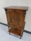A late 19th century mahogany and beech double door cabinet on raised legs