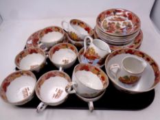 A tray of thirty three pieces of antique tea china in an oriental style