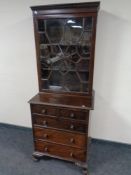 A 19th century mahogany and oak astragal glazed bookcase on five drawer chest,