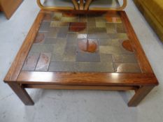 A mid century Danish rosewood tiled coffee table