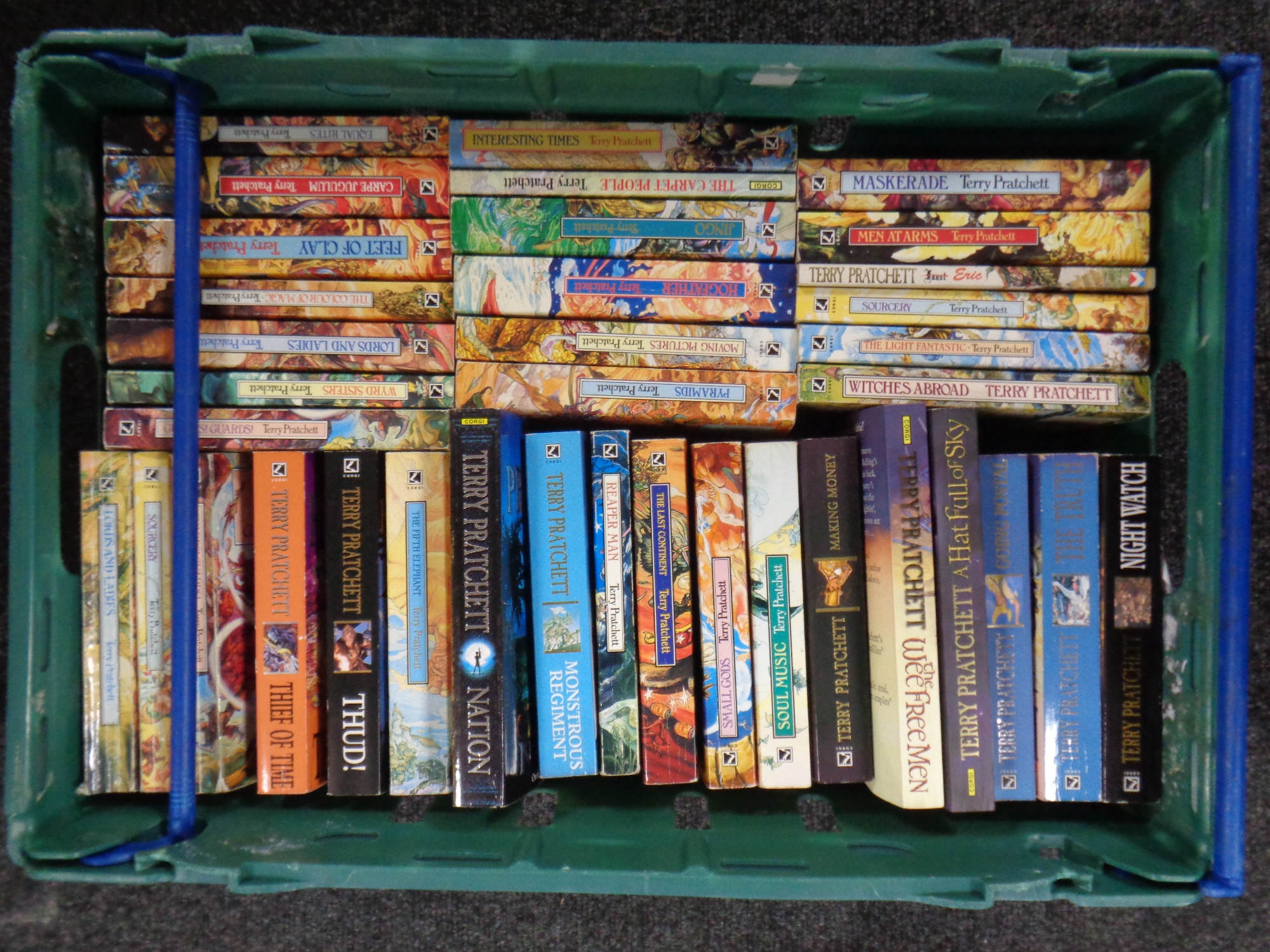 A box of quantity of Terry Pratchett paperback books