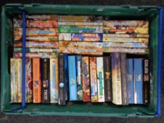A box of quantity of Terry Pratchett paperback books