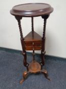 A reproduction mahogany wig stand