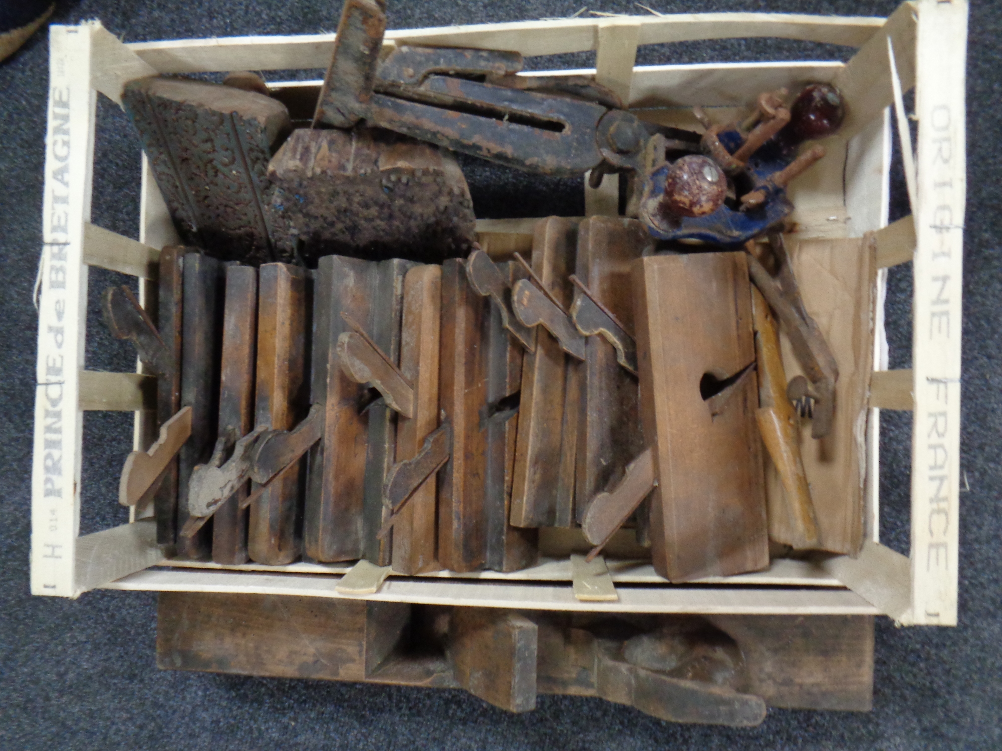A crate of vintage wood working tools - planes,