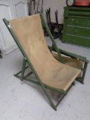 Two mid century folding wooden and canvas deck chairs