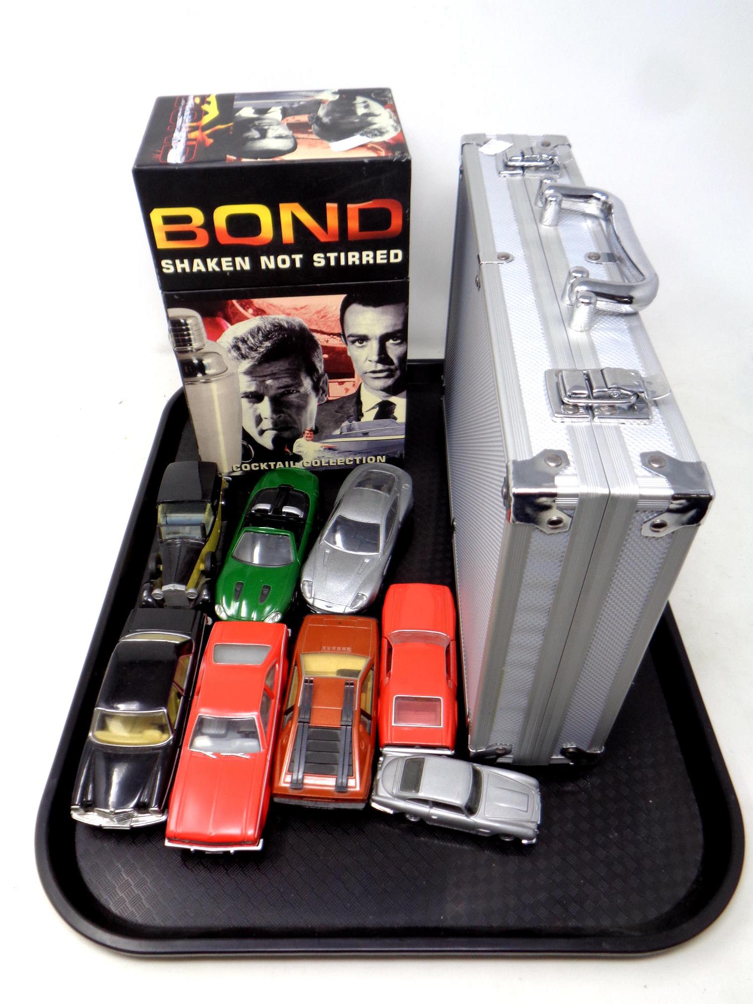 A tray of seven assorted Corgi James Bond die cast cars, boxed James Bond cocktail collection,