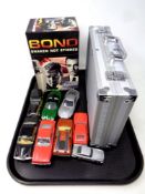 A tray of seven assorted Corgi James Bond die cast cars, boxed James Bond cocktail collection,