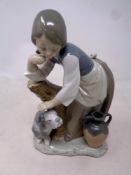 A Lladro figure - girl with dog