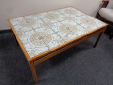 A Scandinavian tiled topped teak coffee table