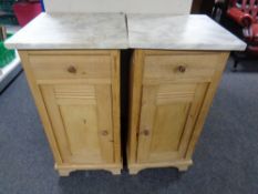 A pair of antique pine marble topped pot cupboards fitted a drawer