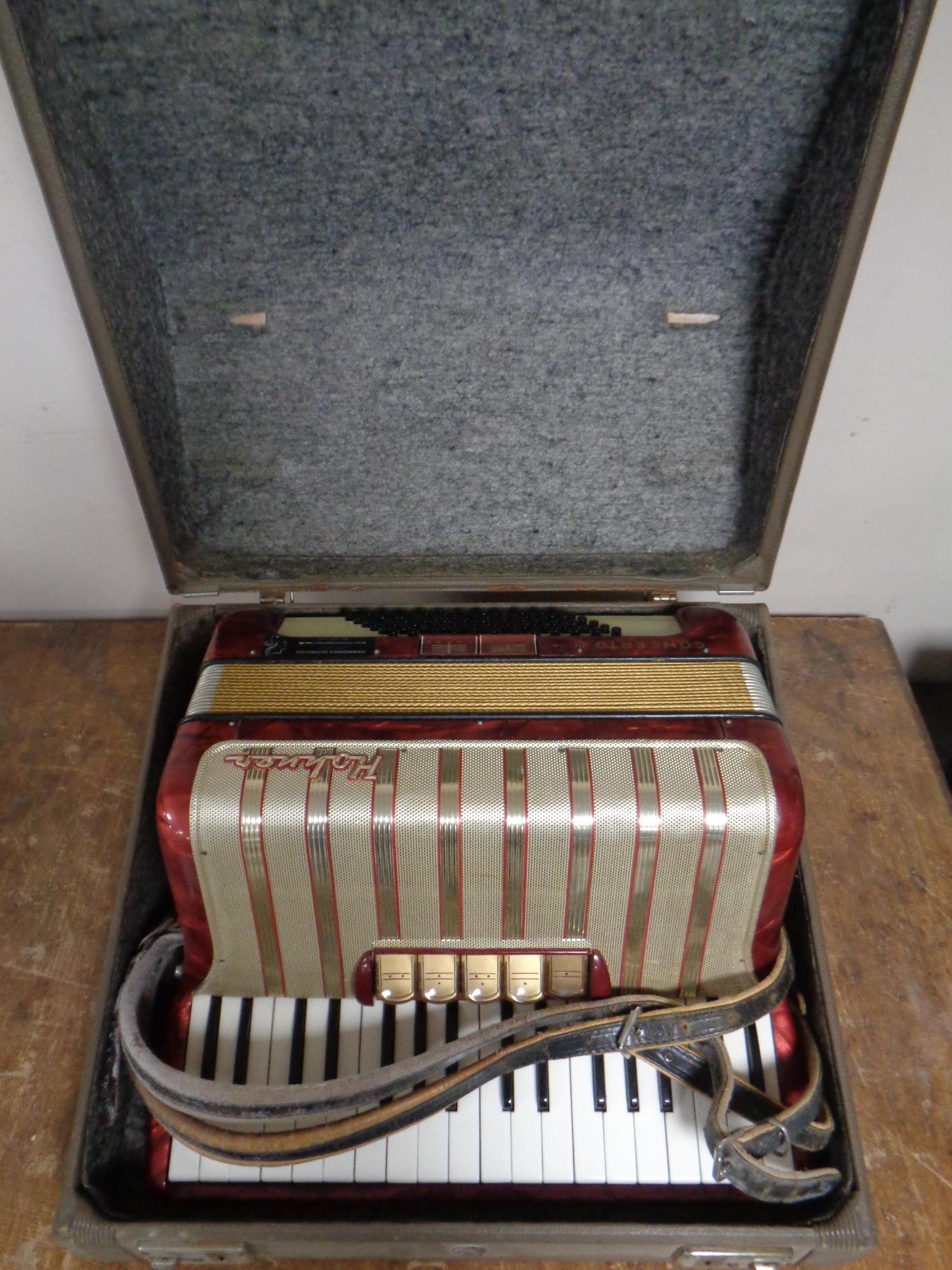 A Hohner piano accordion in case