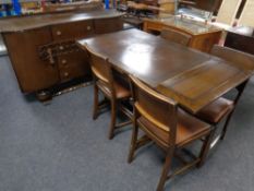A 20th century oak shaped front sideboard with four central drawers,