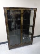 A Japanese lacquered double door floor standing curio cabinet