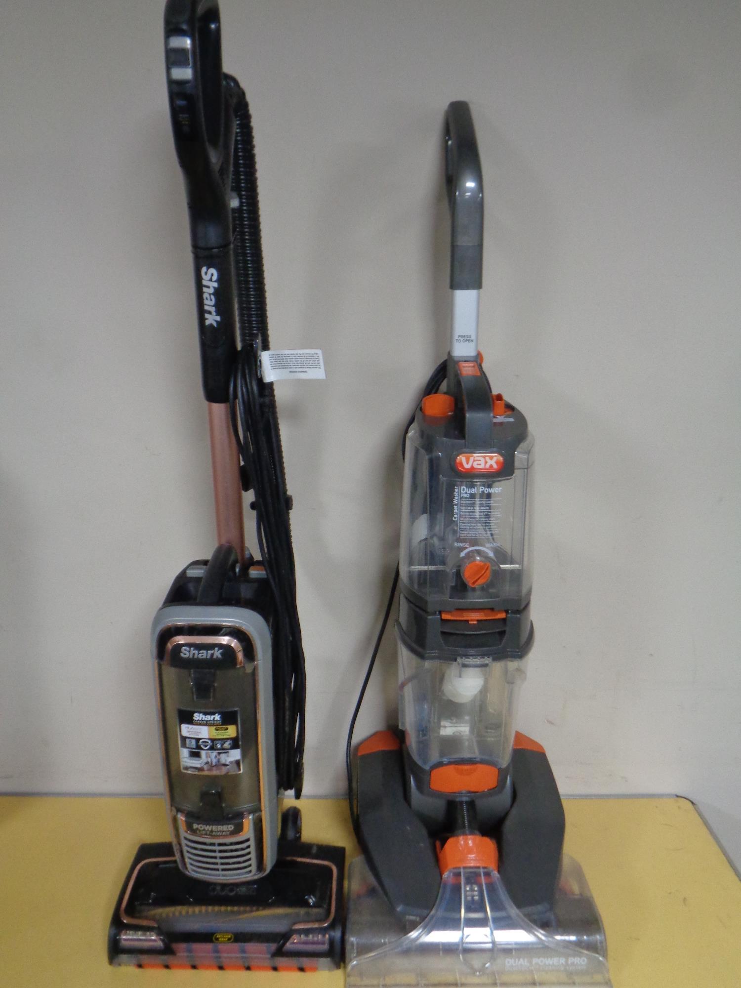 A Vax carpet washer and a Shark corded upright vacuum cleaner