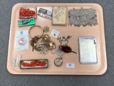 A tray containing silver fob watch, costume jewellery, cigarette case,
