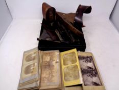A box of antique stereo scope viewers and parts,