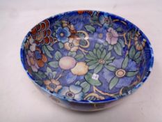 A Bursley Ware bowl, decorated with flowers,