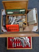 A box of cased canteen of cutlery,
