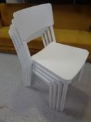A set of four moulded plastic stacking chairs