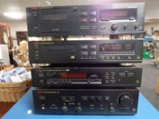 A four piece Luxman stack system - stereo cassette deck K-322, compact disc player D-322,