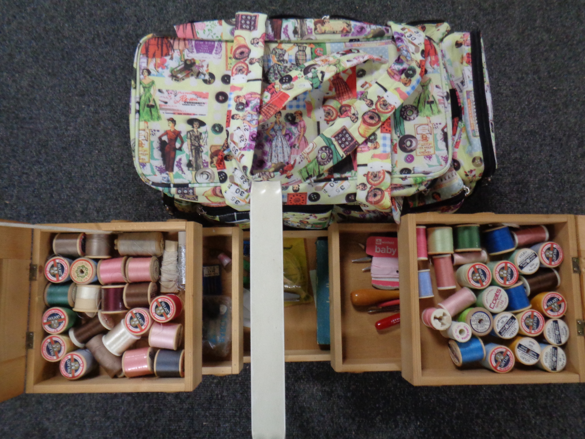 A concertina sewing box with contents and a crafting bag