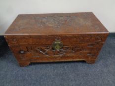 A carved camphor wood blanket box