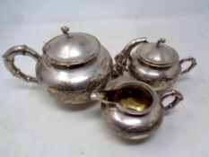 A Chinese silver three piece tea service, with bamboo decoration,