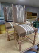A set of three blond oak dining chairs upholstered in a striped fabric
