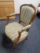 A French style carved beech salon chair in tapestry fabric