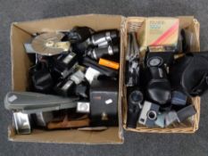 Two boxes of assorted cameras, camera accessories,